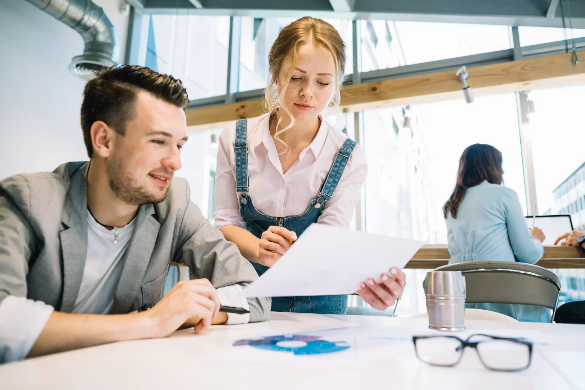 collaborating man woman with papers